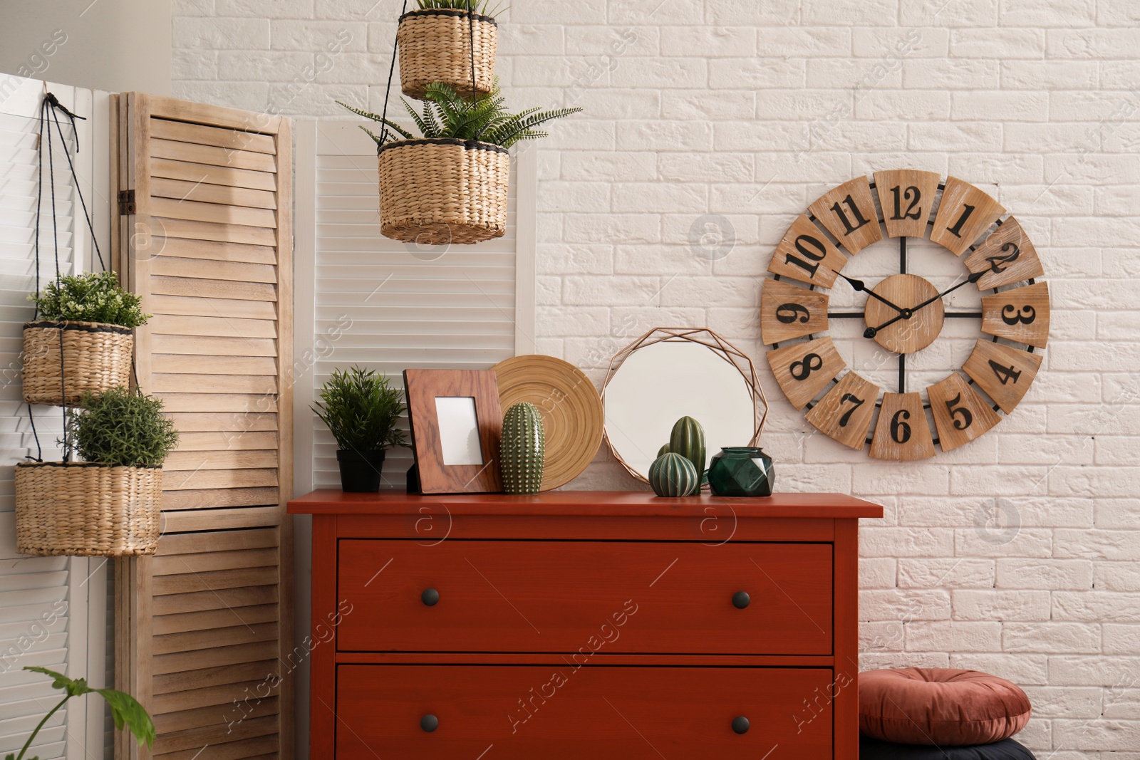 Photo of Stylish room interior with chest of drawers