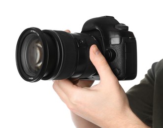 Photographer holding modern camera on white background, closeup