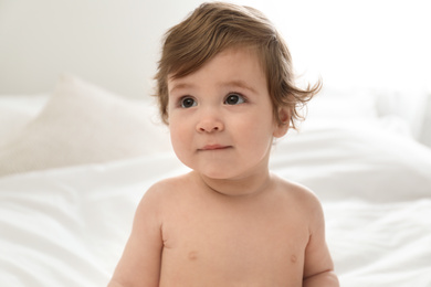 Adorable little baby on bed. Cute child