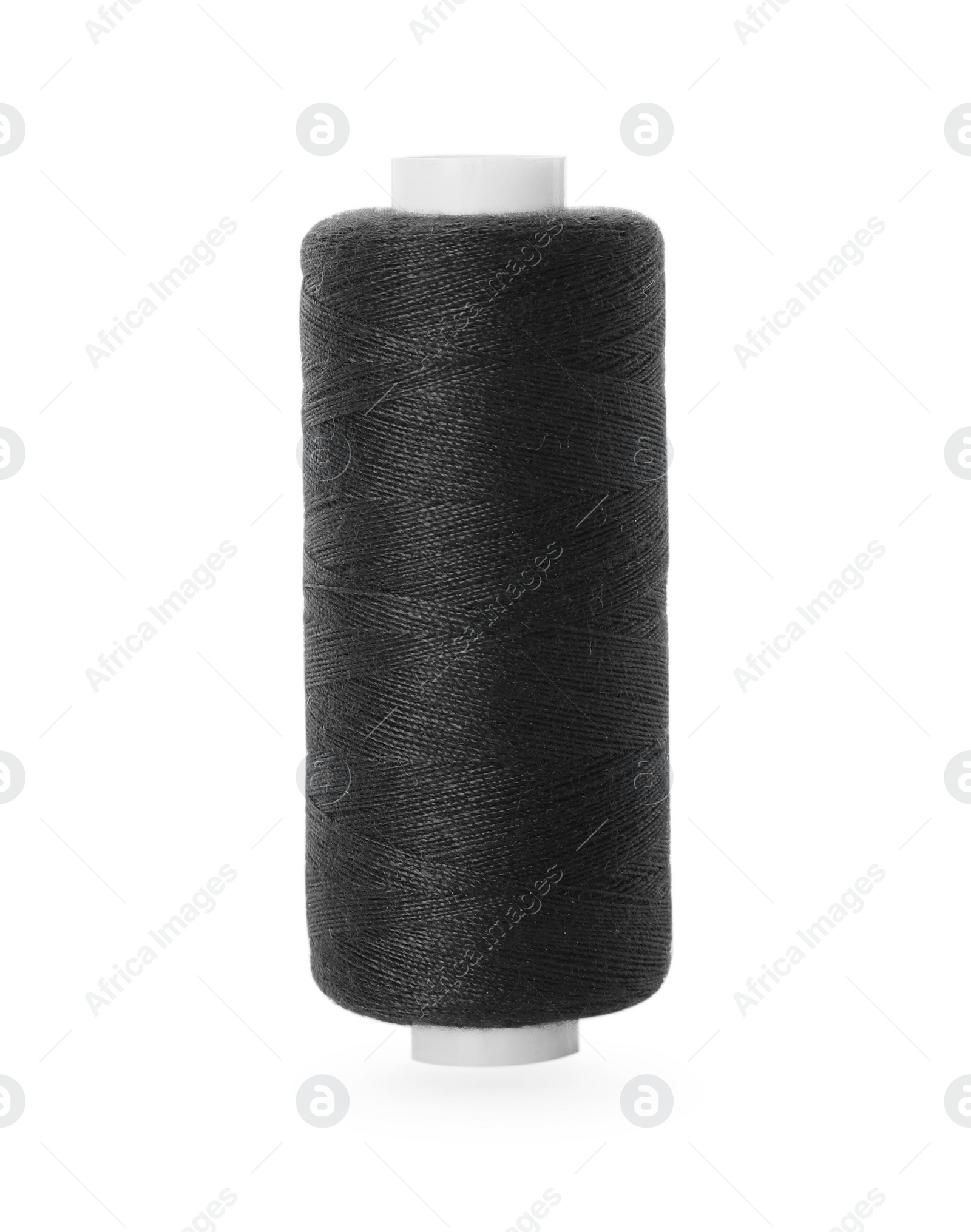 Photo of Spool of black sewing thread isolated on white