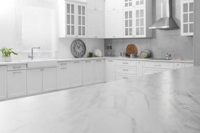 Stylish white marble countertop in kitchen. Interior design