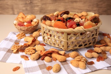 Photo of Mixed dried fruits and nuts on beige background