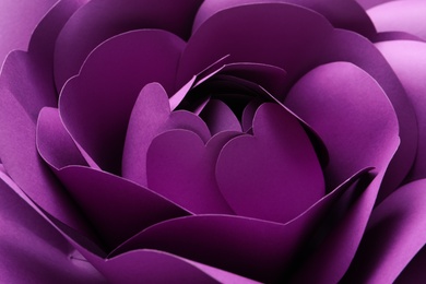 Photo of Beautiful purple flower made of paper as background, closeup