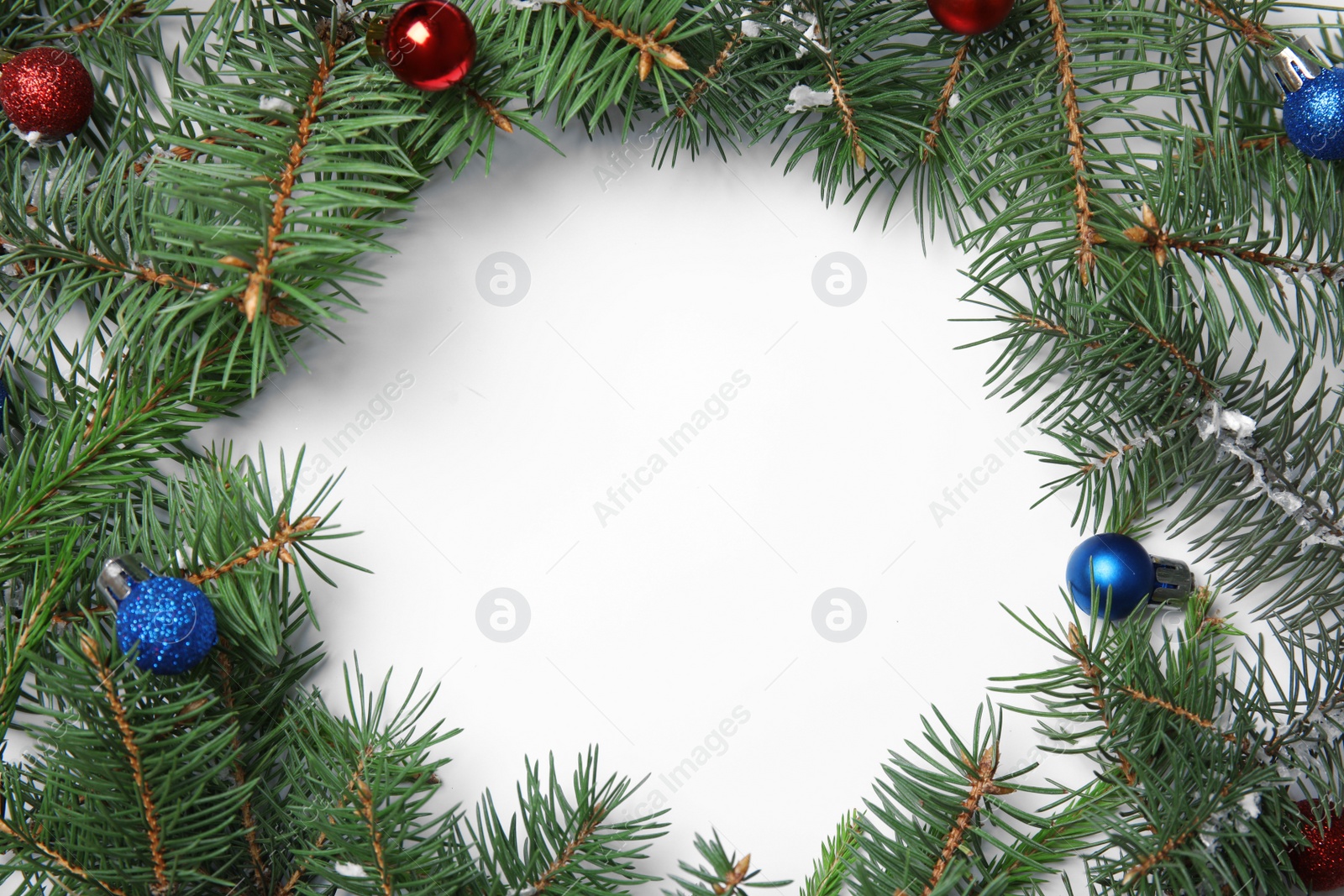 Photo of Frame made with Christmas decor on white background, top view. Space for text