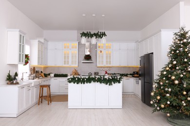 Photo of Cozy spacious kitchen decorated for Christmas. Interior design