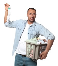 Photo of Young man with basket full of laundry on white background