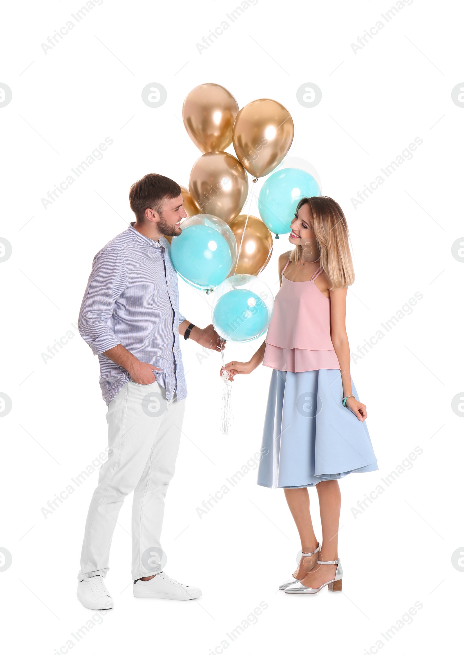 Photo of Young couple with air balloons on white background