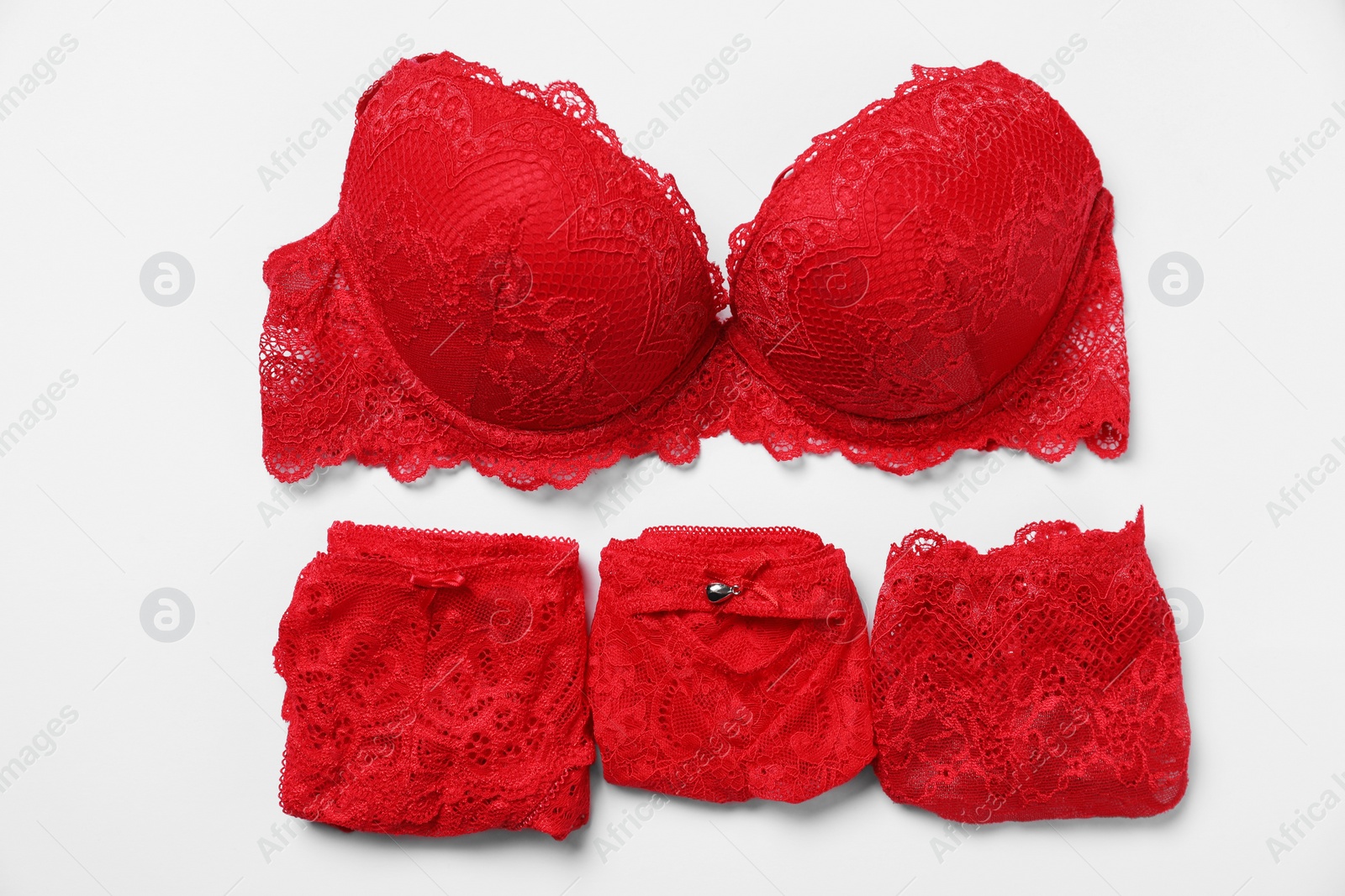 Photo of Stylish red women's underwear on white background, flat lay