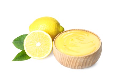 Photo of Delicious lemon curd, fresh fruits and green leaves on white background