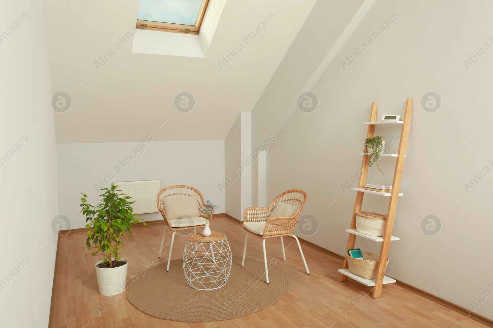 Photo of Attic room with stylish wooden furniture. Interior design