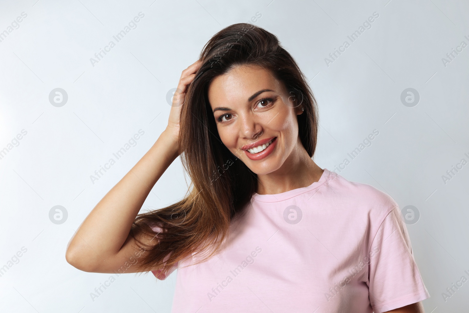 Photo of Portrait of beautiful woman on white background