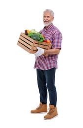 Photo of Harvesting season. Farmer holding wooden crate with vegetables on white background