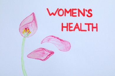 Words Women's Health and drawing of tulip flower on white background, top view