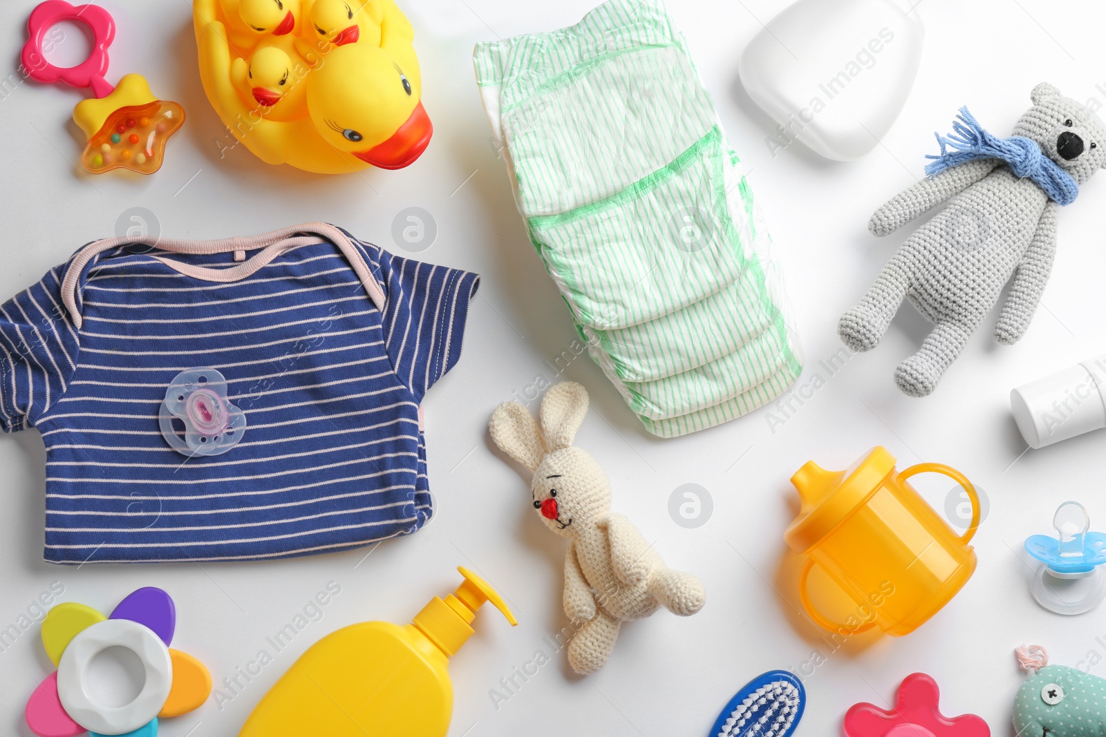 Photo of Flat lay composition with baby accessories on white background