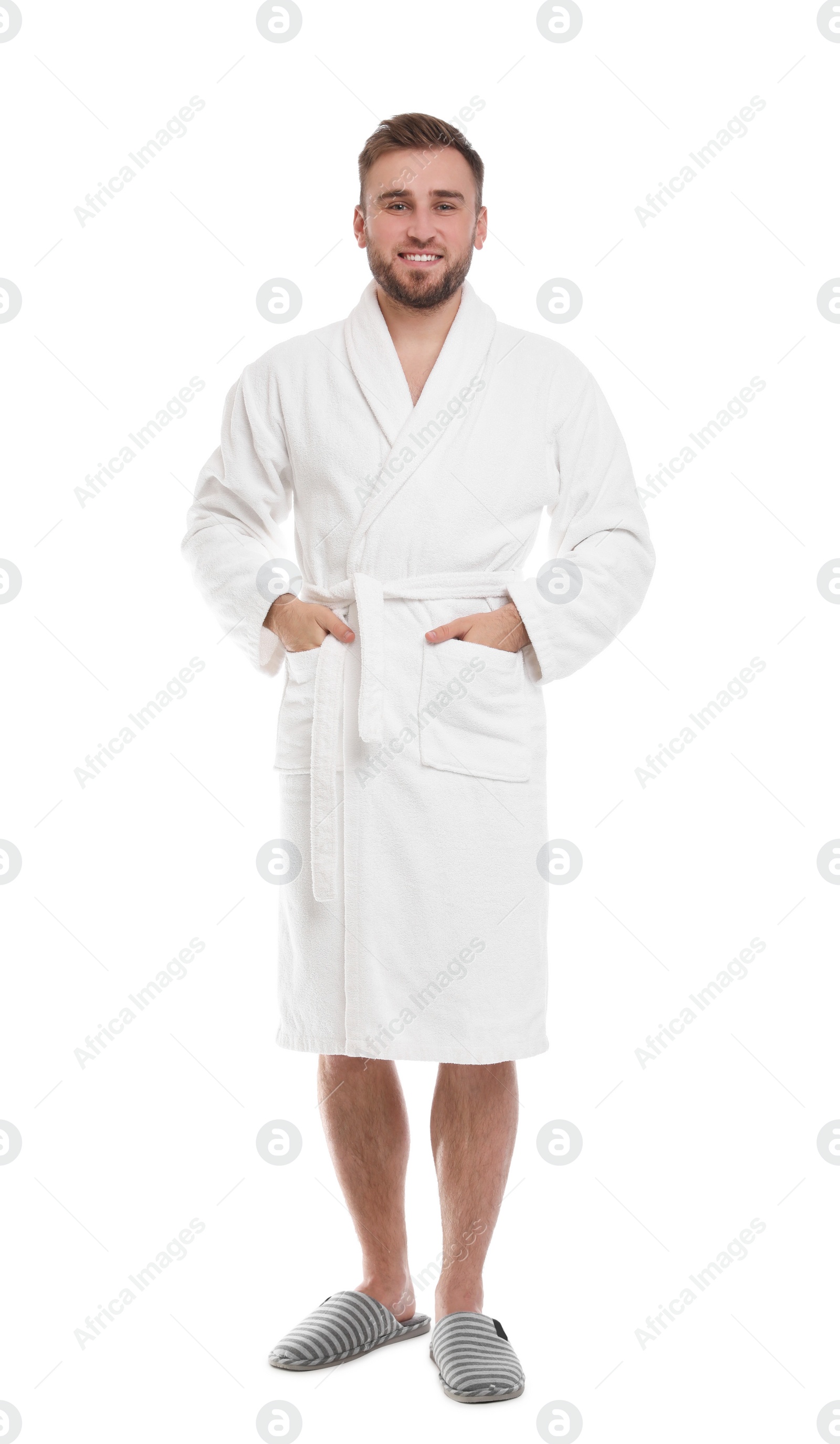 Photo of Handsome man wearing bathrobe on white background