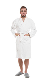 Photo of Handsome man wearing bathrobe on white background