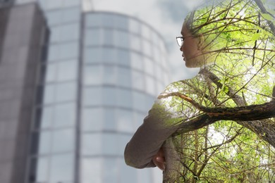 Image of Double exposure of businesswoman and green trees in city