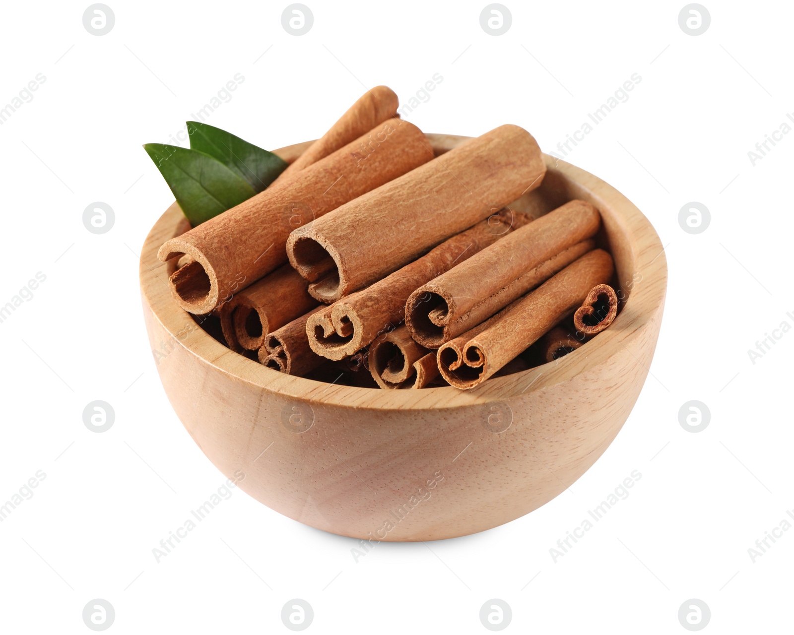 Photo of Cinnamon sticks and green leaves in bowl isolated on white