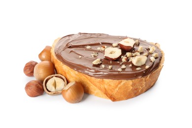 Bread with tasty chocolate spread and pieces of hazelnuts on white background