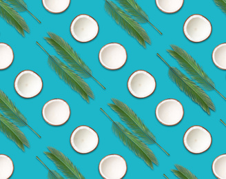 Image of Pattern of coconut halves and palm leaves on blue background