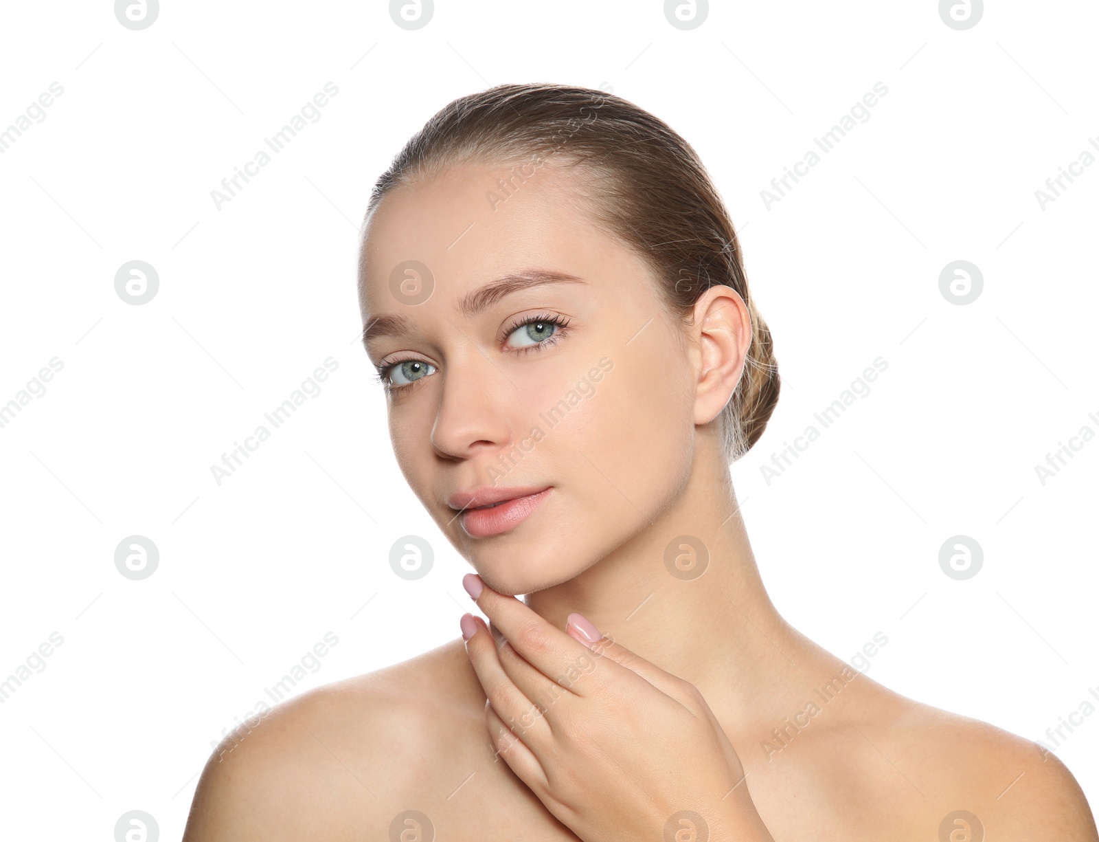 Photo of Portrait of young woman with foundation on her face against white background