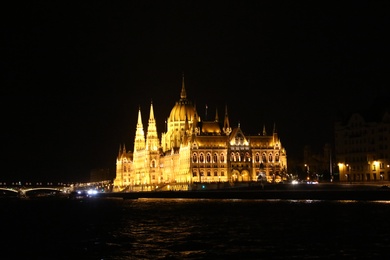 BUDAPEST, HUNGARY - APRIL 27, 2019: Beautiful night cityscape with illuminated Parliament Building