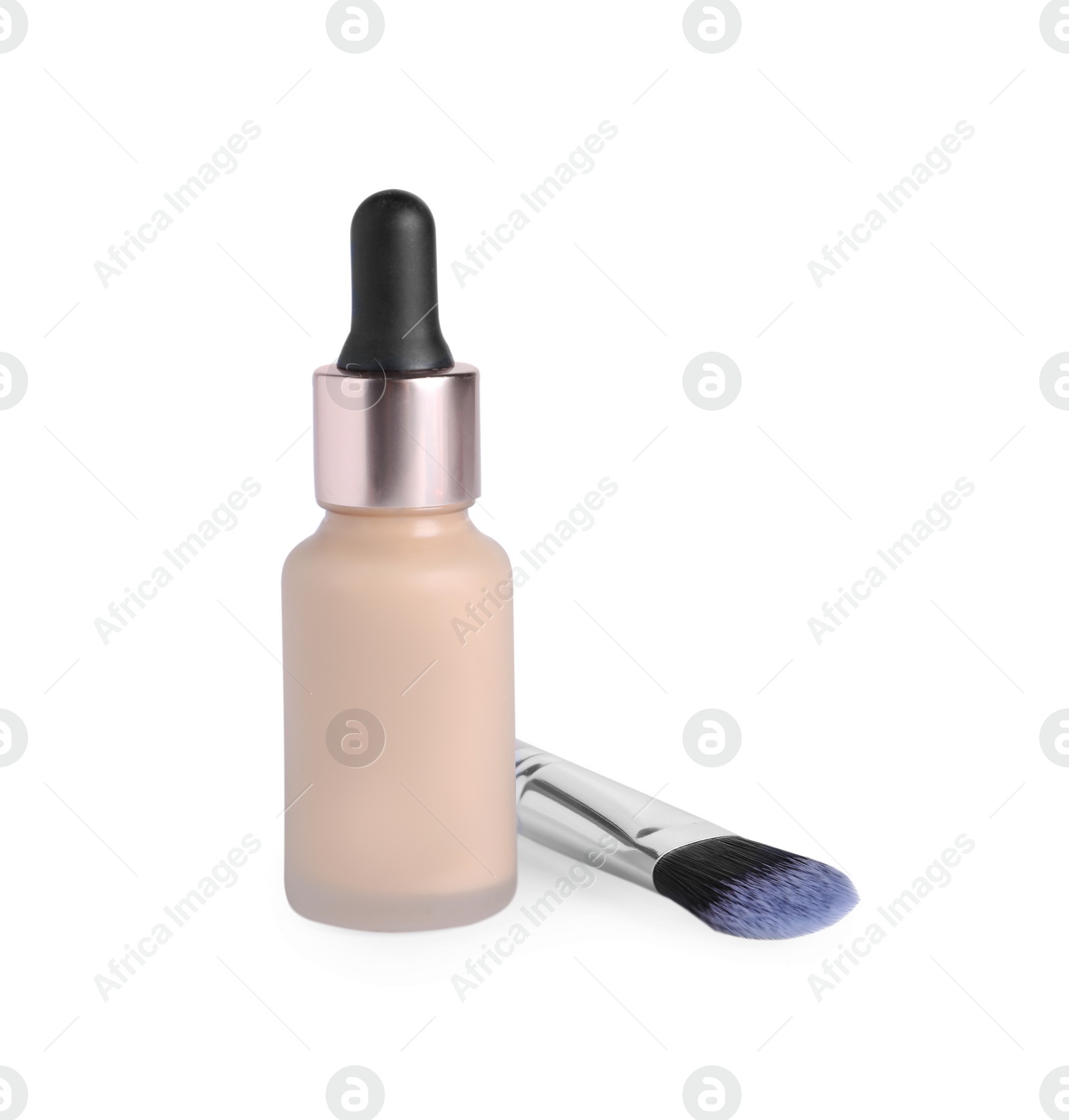 Photo of Bottle of skin foundation and brush on white background. Makeup product