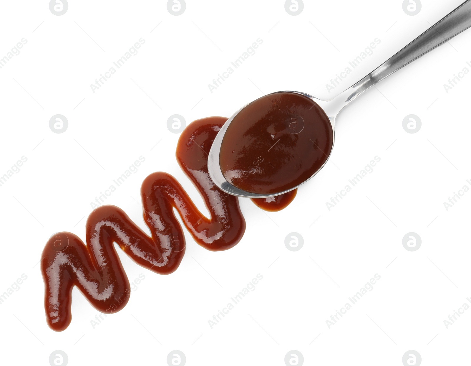 Photo of Tasty barbecue sauce and spoon isolated on white, top view