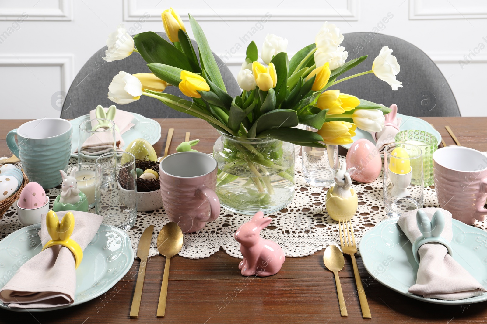 Photo of Festive table setting with beautiful flowers. Easter celebration