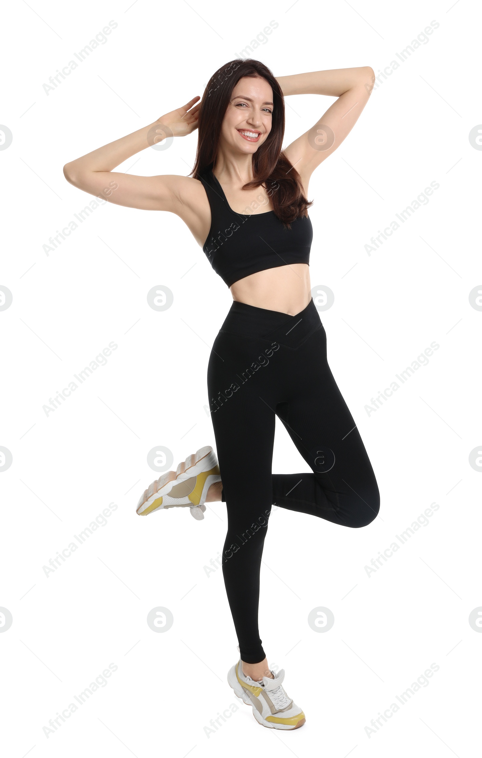 Photo of Happy young woman with slim body posing on white background