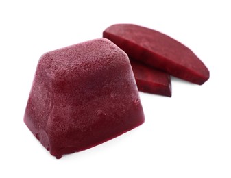 Photo of Frozen beetroot puree cube and fresh beetroot isolated on white