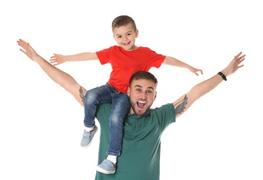 Father and son having fun on white background