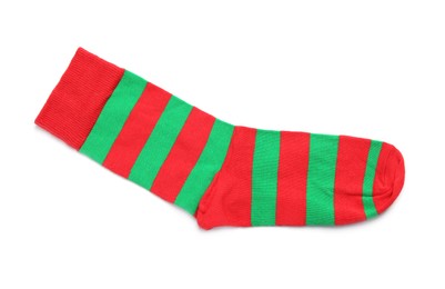 Photo of New striped sock on white background, top view