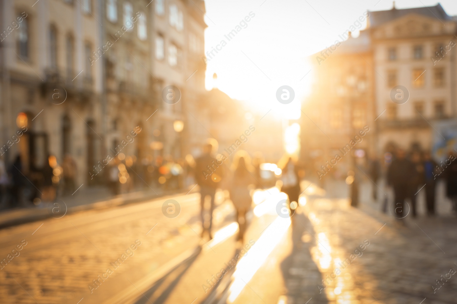 Photo of Blurred view of people walking on city street