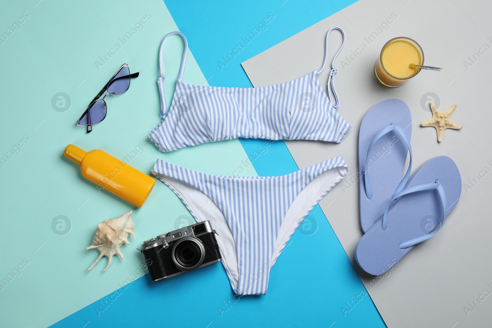 Photo of Flat lay composition with beach objects on color background