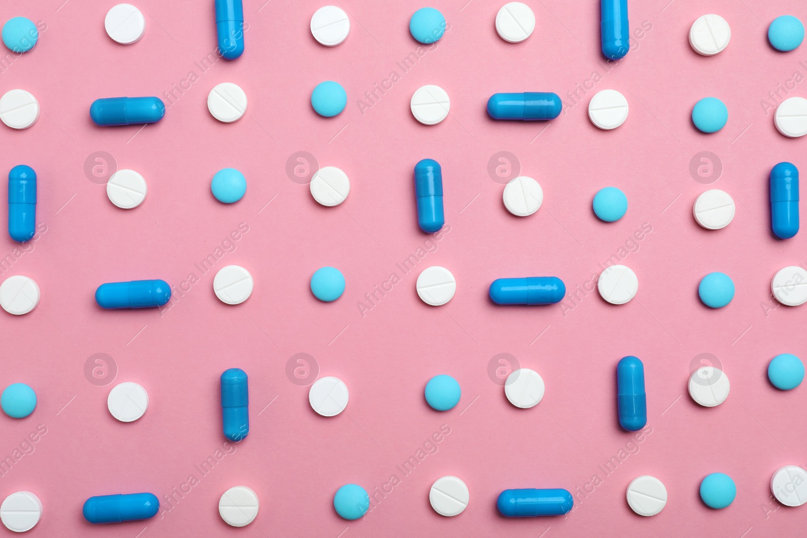 Photo of Different pills and capsules on color background, flat lay