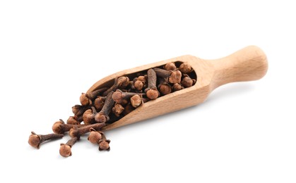 Photo of Wooden scoop with aromatic dry cloves on white background