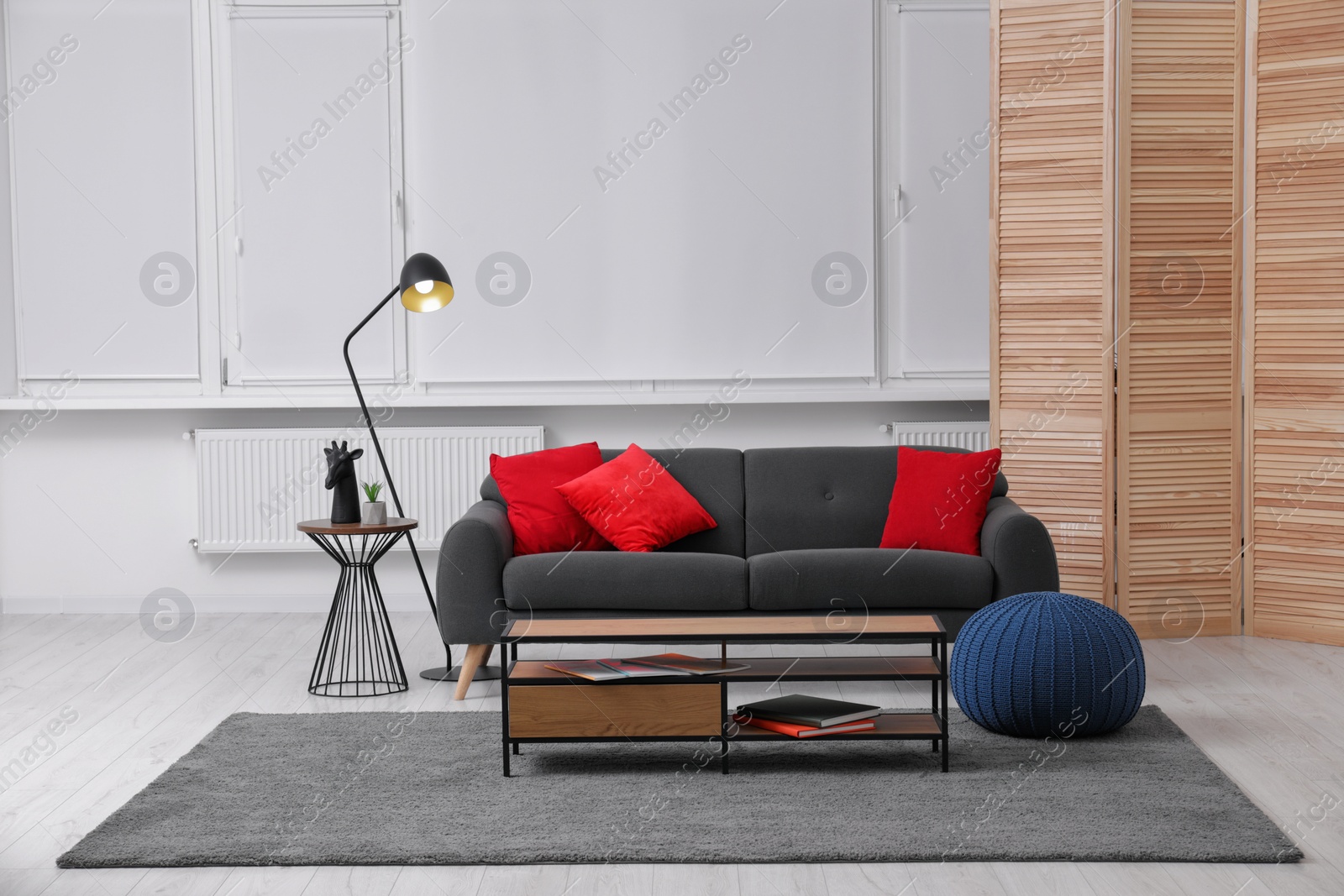 Photo of Comfortable furniture and floor lamp in stylish room. Interior design
