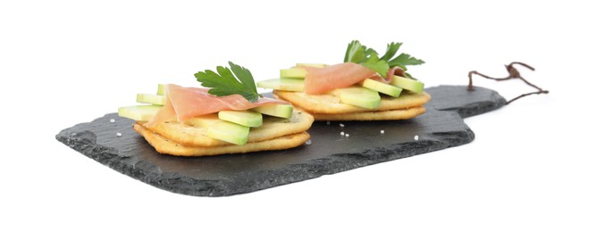 Photo of Delicious crackers with avocado, prosciutto and parsley on white background