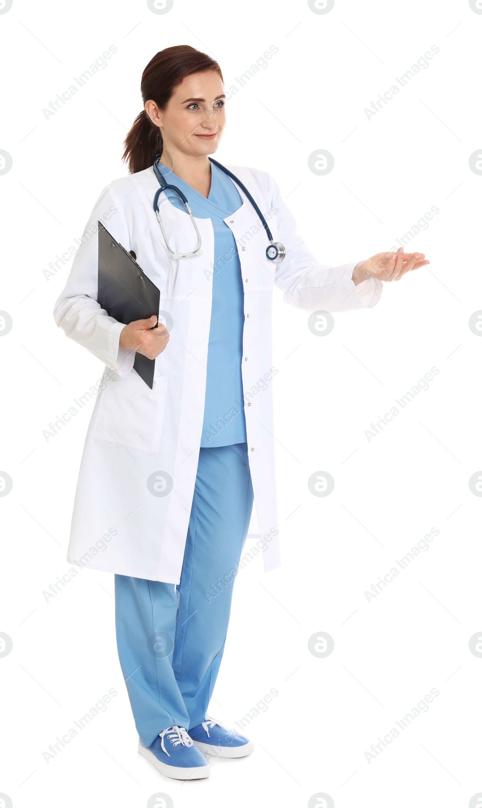 Photo of Full length portrait of female doctor with clipboard isolated on white. Medical staff