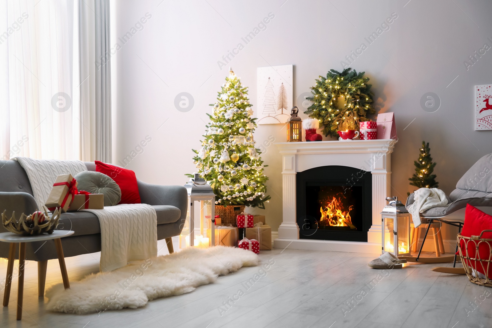 Photo of Stylish living room interior with beautiful fireplace, Christmas tree