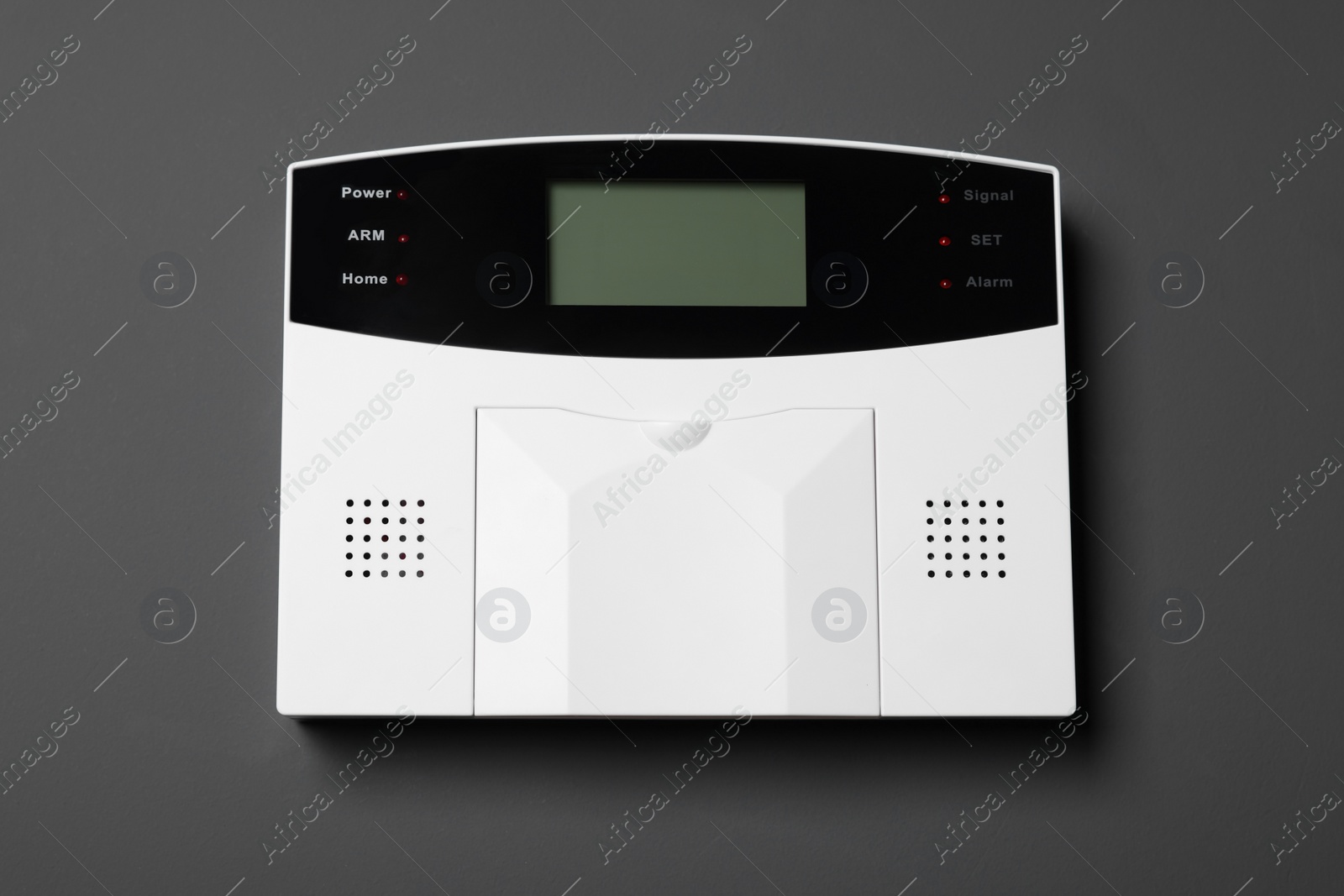 Photo of Home security alarm system on gray wall