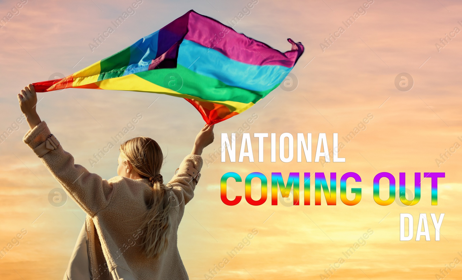 Image of National Coming Out day. Woman holding bright LGBT flag against sky, back view