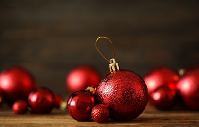 Photo of Many beautiful Christmas balls on wooden table