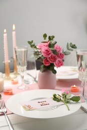 Romantic table setting with flowers and candles