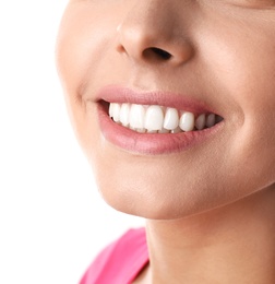 Young woman with healthy teeth on white background, closeup