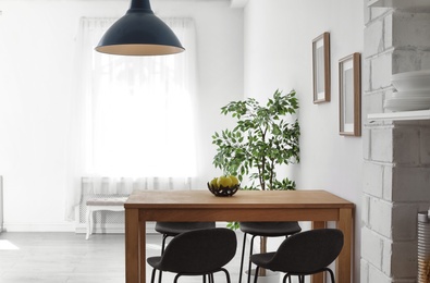 Photo of Stylish dining room interior. Home design idea