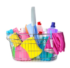 Metal shopping basket with different household chemicals on white background