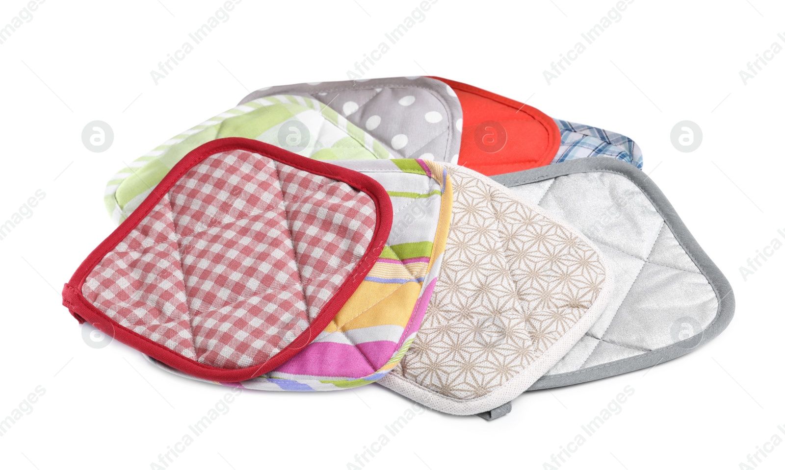 Photo of Set of oven potholders for hot dishes on white background