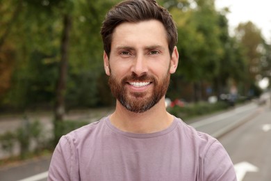 Photo of Portrait of handsome bearded man on street